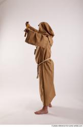 JOEL_ADAMSON WITH CRUCIFIX AND SWORD